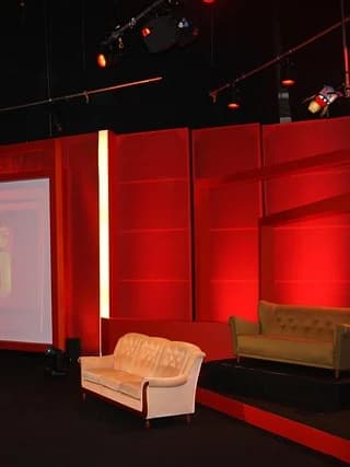 Red television studio set with lights