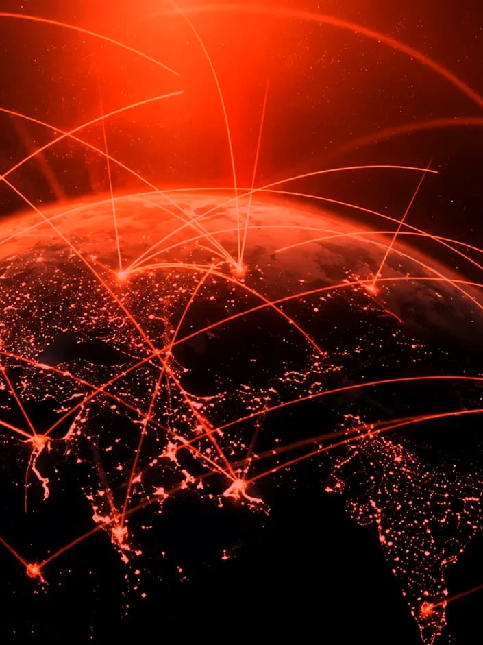 Glowing network lines over the globe at night